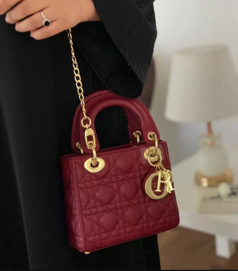 حقيبه ديور جلد مطفي احمر غامق